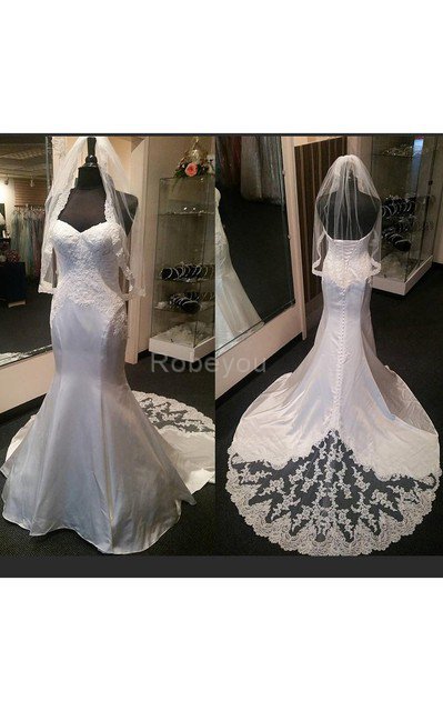 Robe de mariée manche nulle de col en cœur textile taffetas avec décoration dentelle cordon