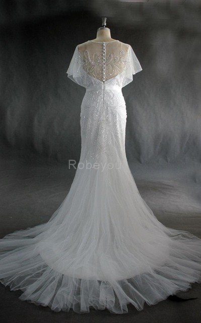 Robe de mariée attirent avec perle au niveau de cou avec manche courte textile en tulle